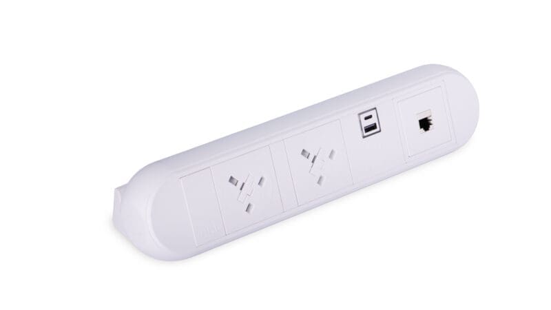 Black desktop power module with two 240V UK sockets on white background