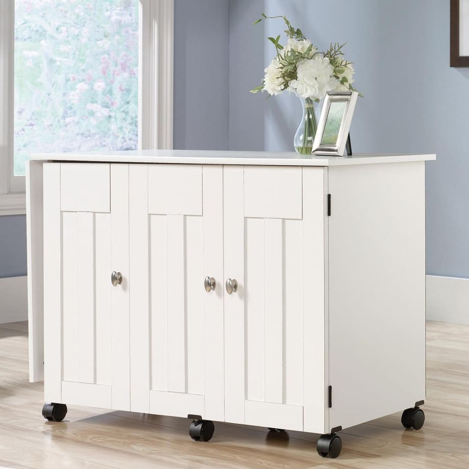 Soft white sewing and craft cart with folding top and concealed storage