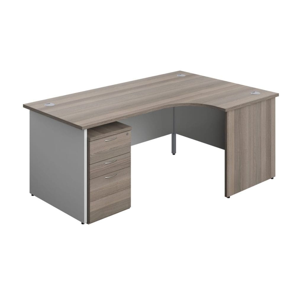 Radial office desk with white legs, modesty panel, and grey cable ports in a wood finish