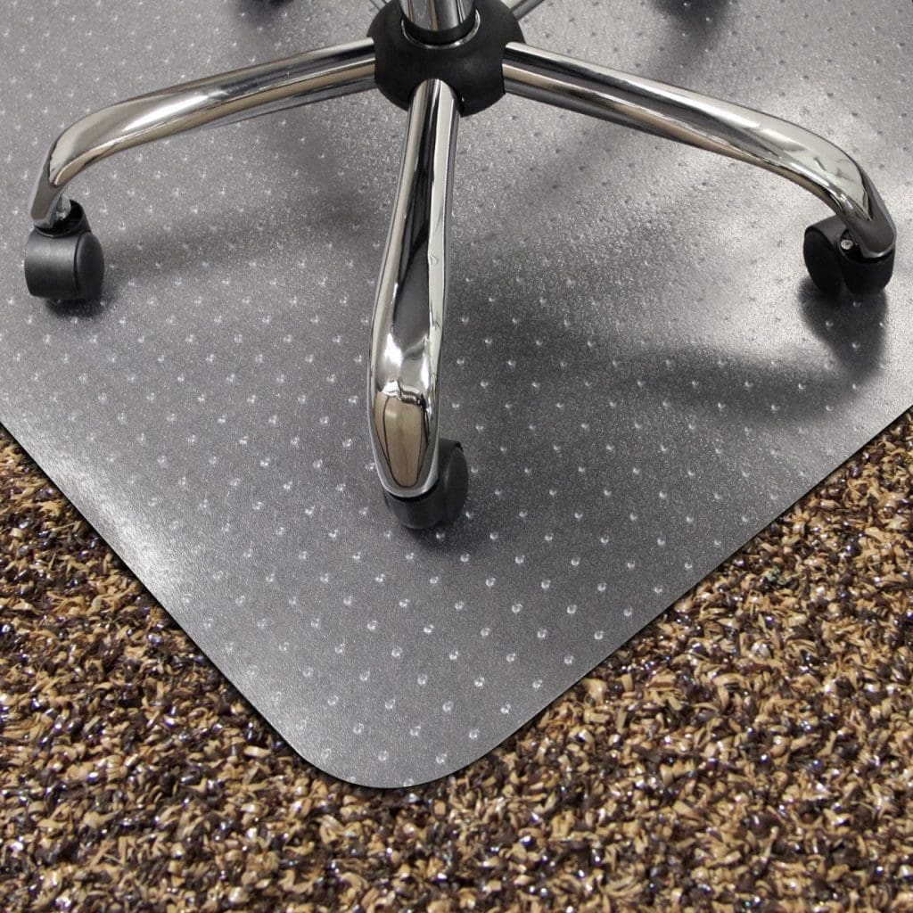 Chair mat for carpet with lipped design and studded underside in office setting
